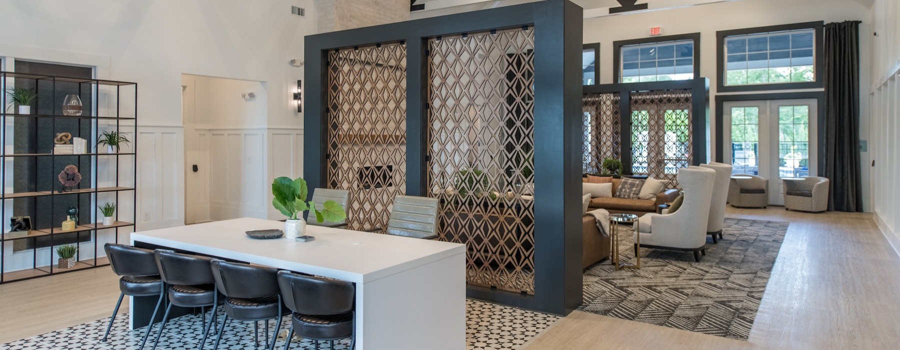 a leasing office with a desk and chairs