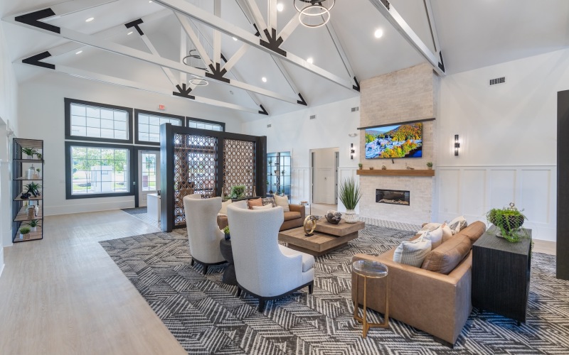 a clubroom with tables and chairs